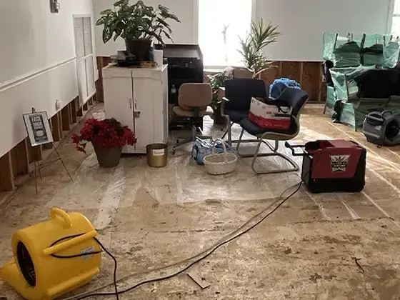 Drying equipment set up in a living room after water damage in Woodstock