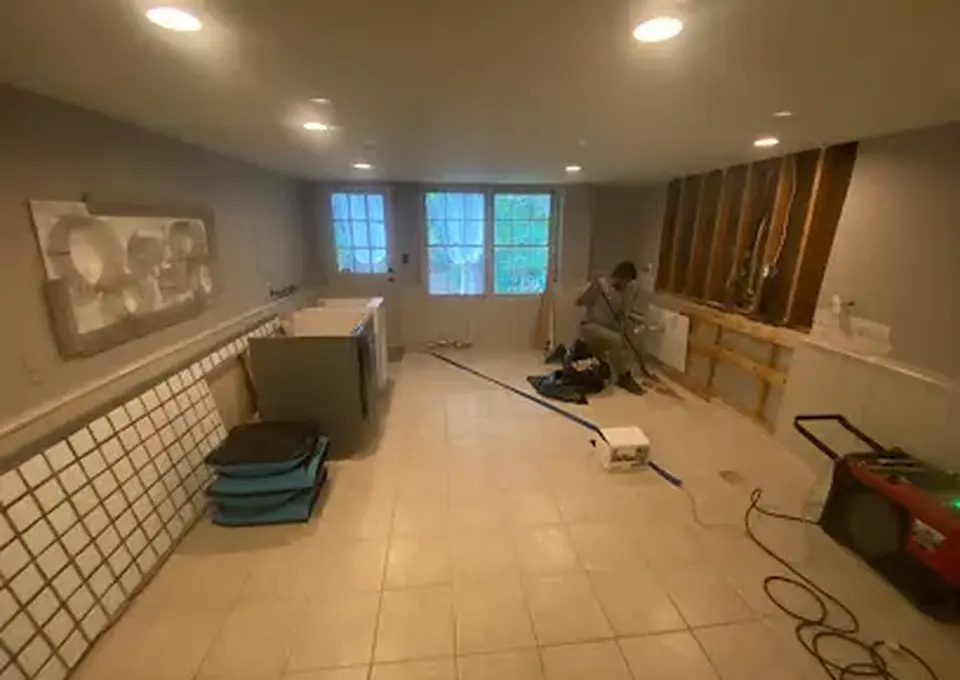 Water damage dry-out with walls opened and drying equipment in a Woodstock, GA home