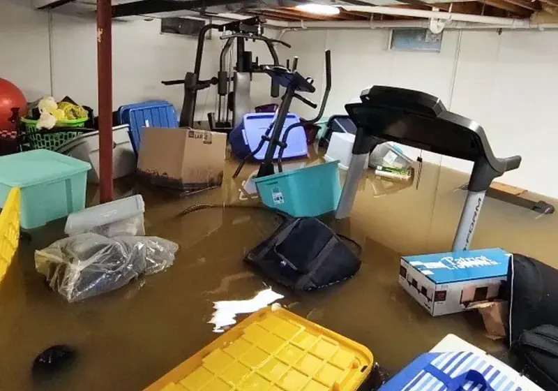 Standing water across a finished basement floor in Woodstock, GA