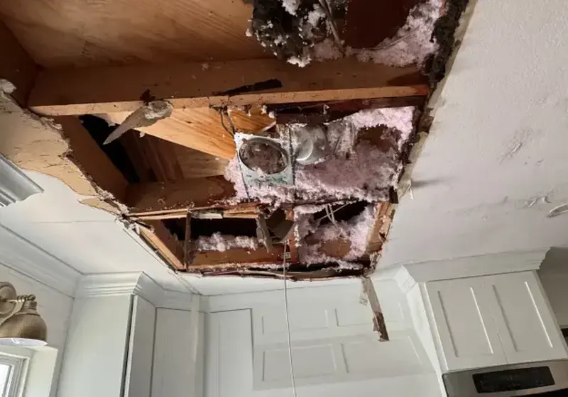 Water-stained and sagging ceiling from a leak above in Woodstock, GA