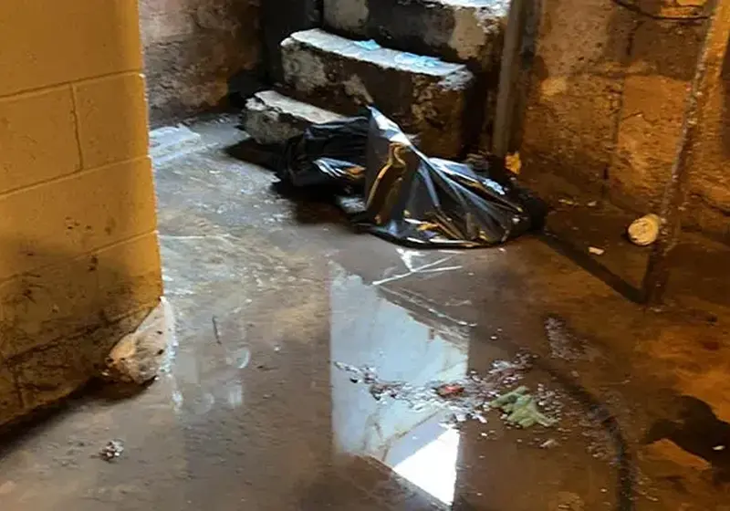 Sewage backup cleanup with protective gear in Woodstock, GA